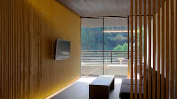 Deluxe Twin Room with Open Air Bath | Living area | TV