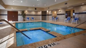 An indoor swimming pool with lounge chairs and a no diving sign. - Best Western Plus Manvel Inn & Suites (Manvel)