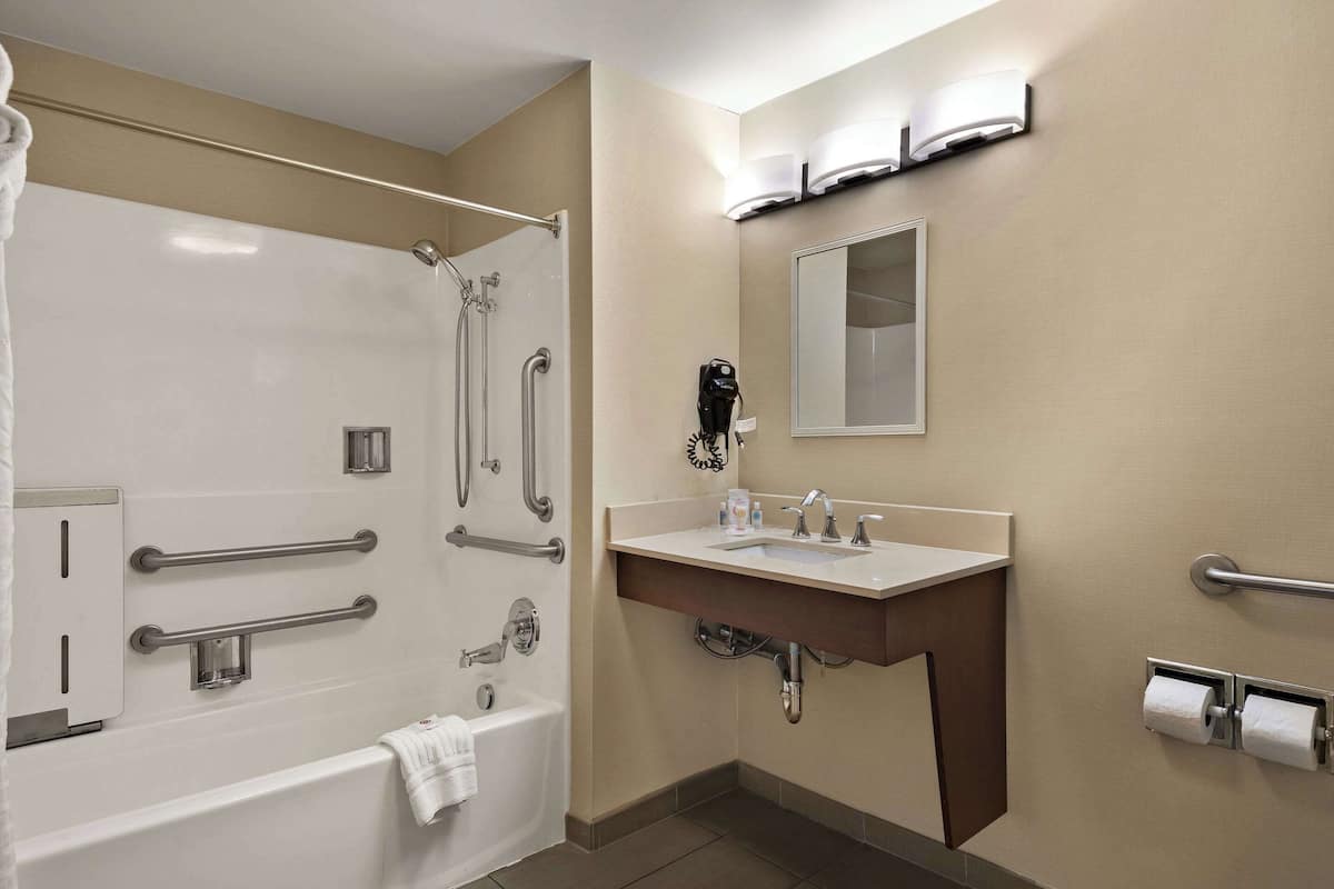 suite, 2 queen beds, accessible, non smoking | bathroom | combined shower/bathtub, free toiletries, hair dryer, towels