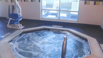 Relax in the hot tub surrounded by a beautiful view and a stylish tile floor.