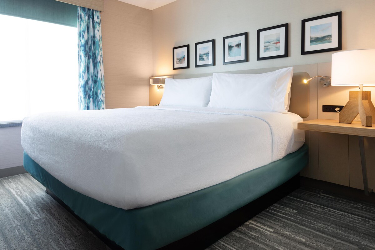 Down comforters, desk, blackout drapes, iron/ironing board