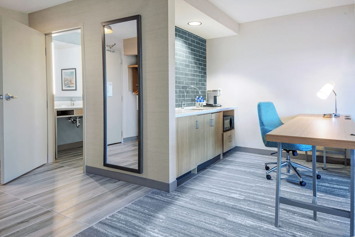 Down comforters, desk, blackout drapes, iron/ironing board