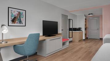 Premium bedding, desk, laptop workspace, iron/ironing board