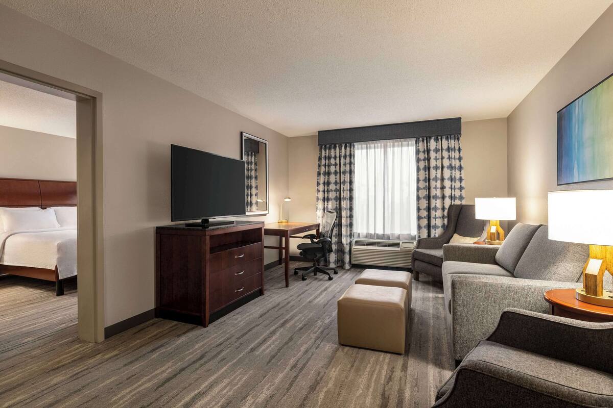 1 king bed 1 bedroom suite | living area | 55-inch smart tv with cable channels, netflix, hulu