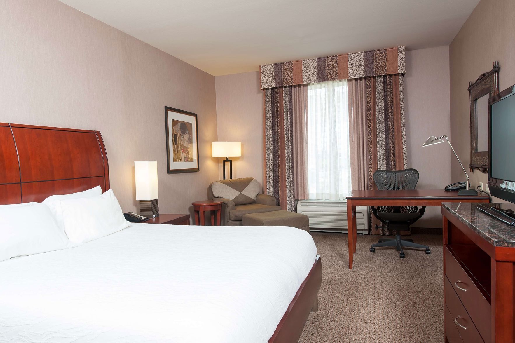 Hypo-allergenic bedding, pillowtop beds, desk, blackout drapes
