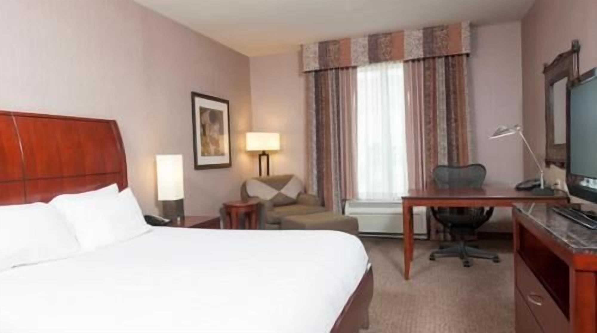 Hypo-allergenic bedding, pillowtop beds, desk, blackout drapes