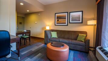 Studio Suite, 1 King Bed, Non Smoking | Living area | 32-inch LCD TV with cable channels, TV, iPod dock