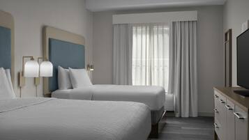 A hotel room with two beds, a large window with curtains, a flat-screen TV, and a minibar.