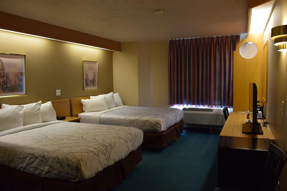 deluxe room, 2 queen beds, refrigerator | desk, free wifi