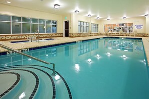 An indoor swimming pool with clear water, marked depth lines, and a tiled edge. - Holiday Inn Express & Suites Newberry by IHG (Newberry)