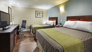 A hotel room with two beds, a desk with a computer, and a chair. - American Inn (Downey)