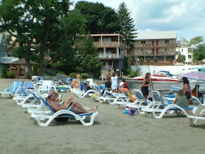 On the beach, sun-loungers, kayaking, rowing