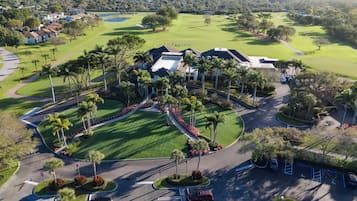 Enjoy a round of golf amidst lush trees and well-manicured greens.