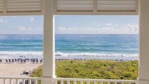 A beach view through a window with beach chairs and umbrellas. - The Seagate Hotel, Golf & Beach Club, Autograph Collection (Delray Beach)