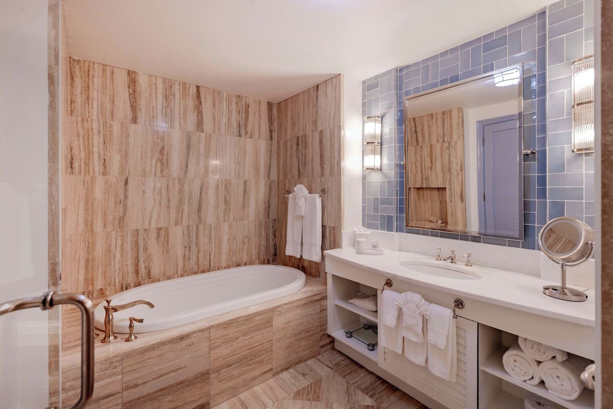 Designer toiletries, hair dryer, bathrobes, slippers