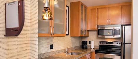 Suite, 2 Bedrooms | Private kitchenette | Full-size fridge, microwave, stovetop, dishwasher