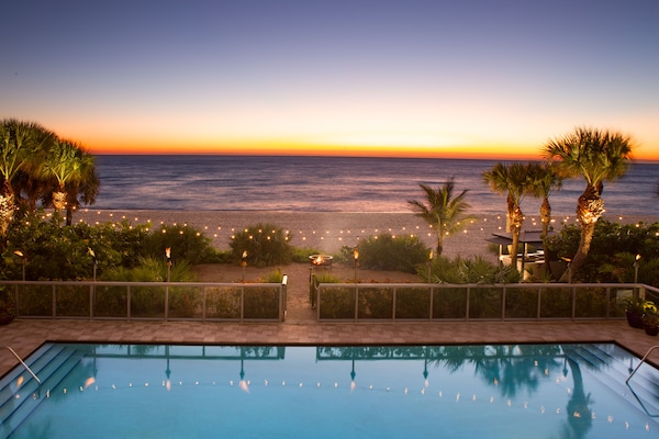 On the beach, sun loungers, beach umbrellas, beach towels