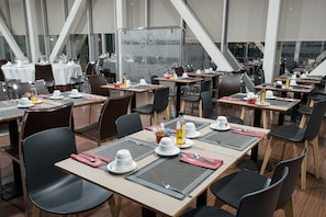 Enjoy a comfortable dining experience in our spacious dining area, where tables are set for groups with ample space between them.