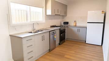 Apartment, 2 Bedrooms | Private kitchen | Fridge, microwave, coffee/tea maker, electric kettle