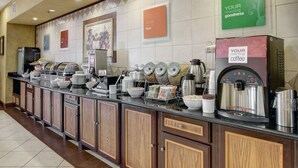 A breakfast bar with coffee machines, bowls, and a variety of food items. - Comfort Inn & Suites Alvarado (Alvarado)