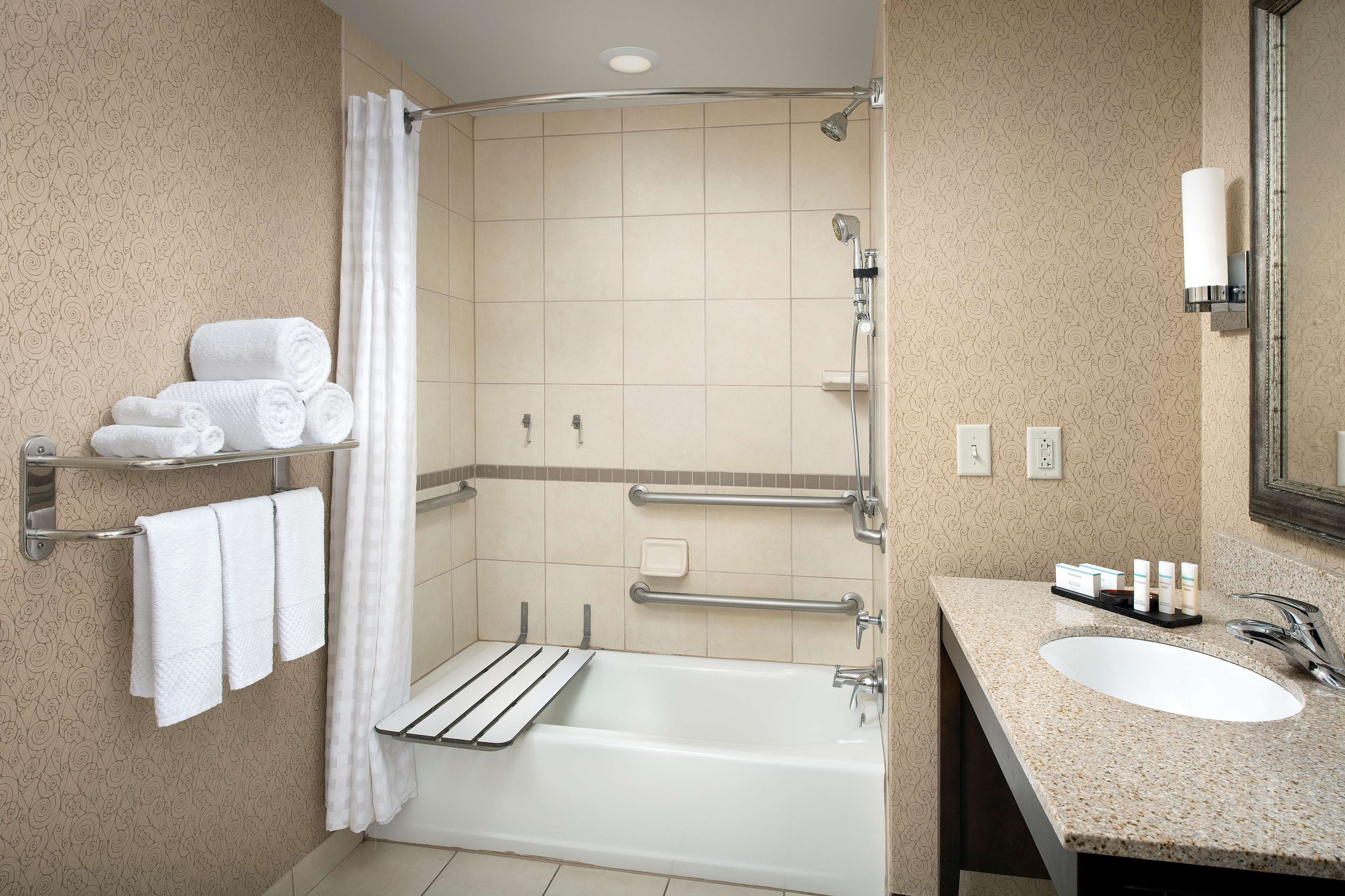 suite, 1 king bed, accessible (mobility & hearing, roll-in shower) | bathroom | combined shower/bathtub, free toiletries, hair dryer, towels