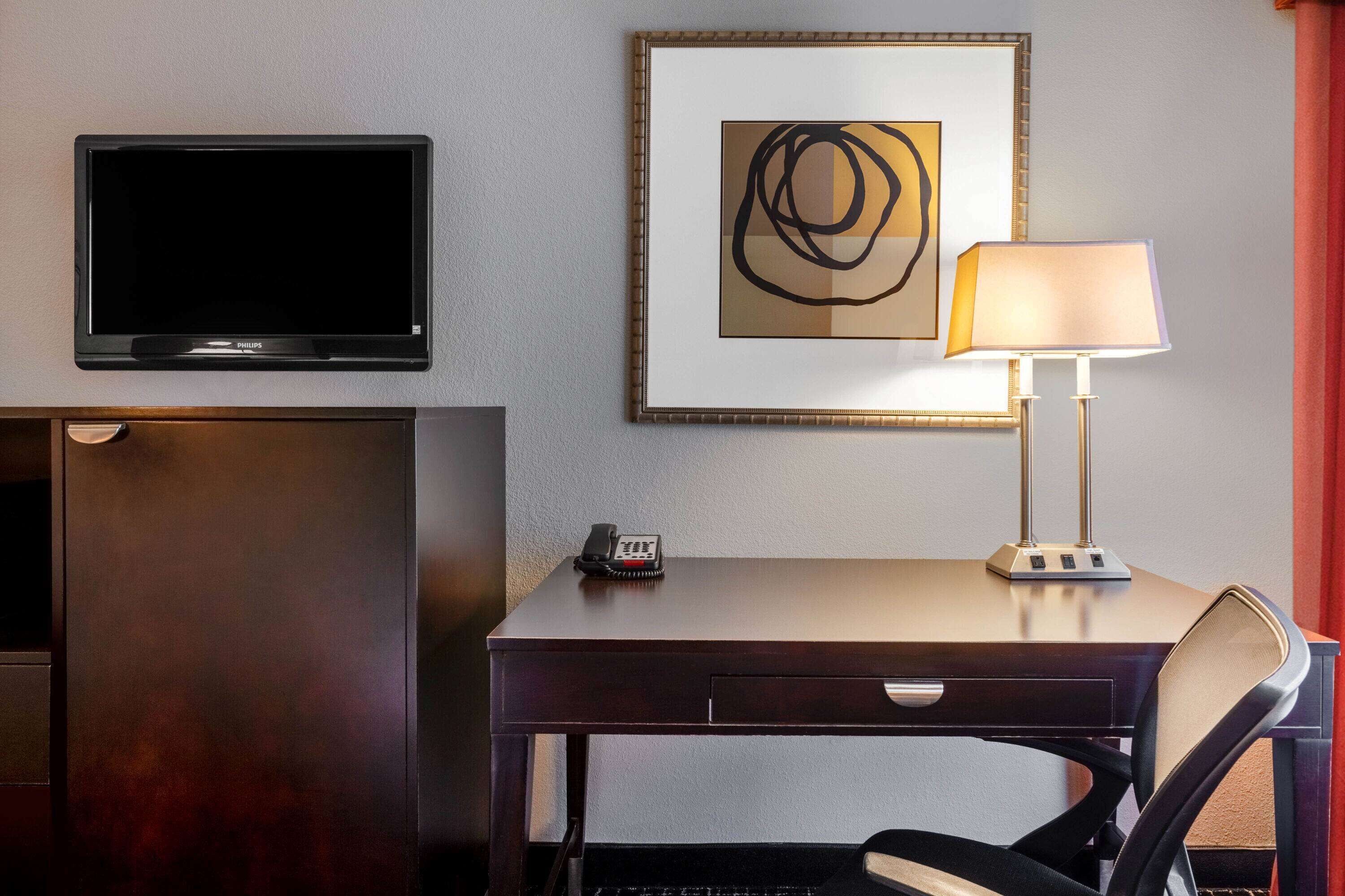 premium bedding, desk, laptop workspace, blackout curtains