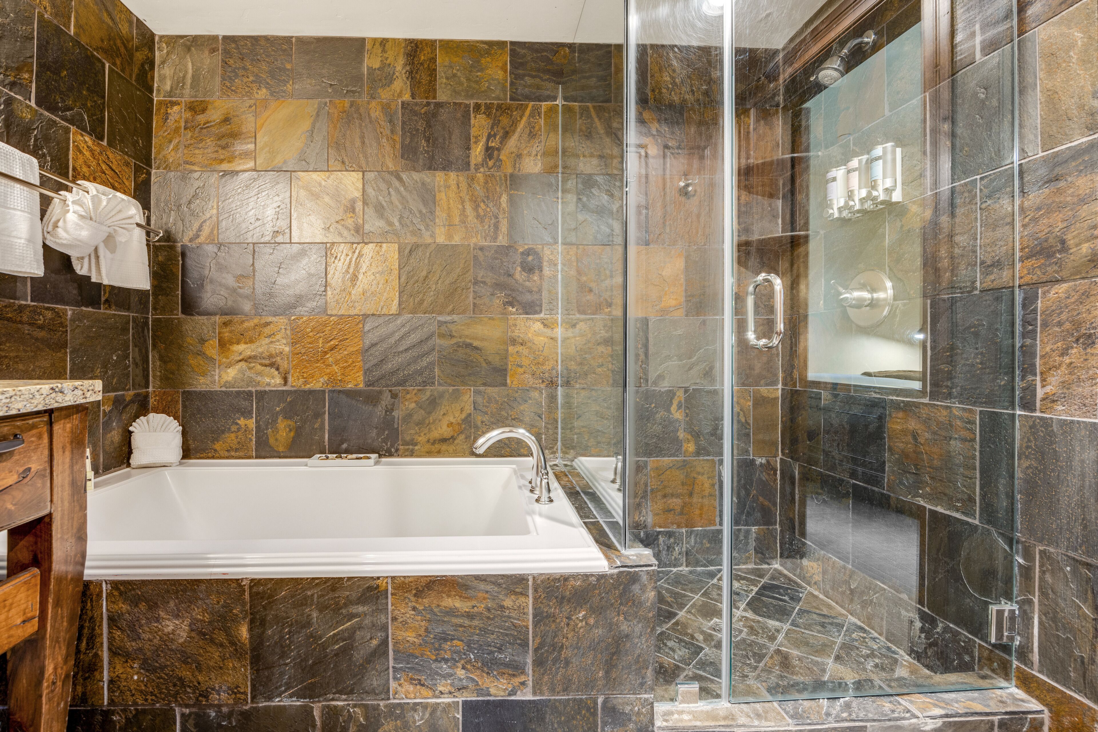 deluxe king suite | bathroom | designer toiletries, hair dryer, bathrobes, towels