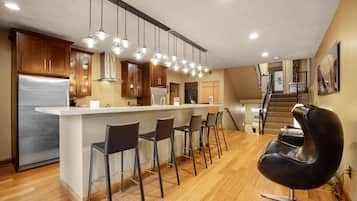 Penthouse Suite | Living area | 40-inch flat-screen TV with cable channels, TV, iPod dock