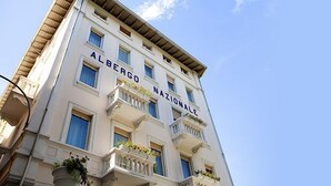 A building with the name "Albergo Nazionale" on its facade.