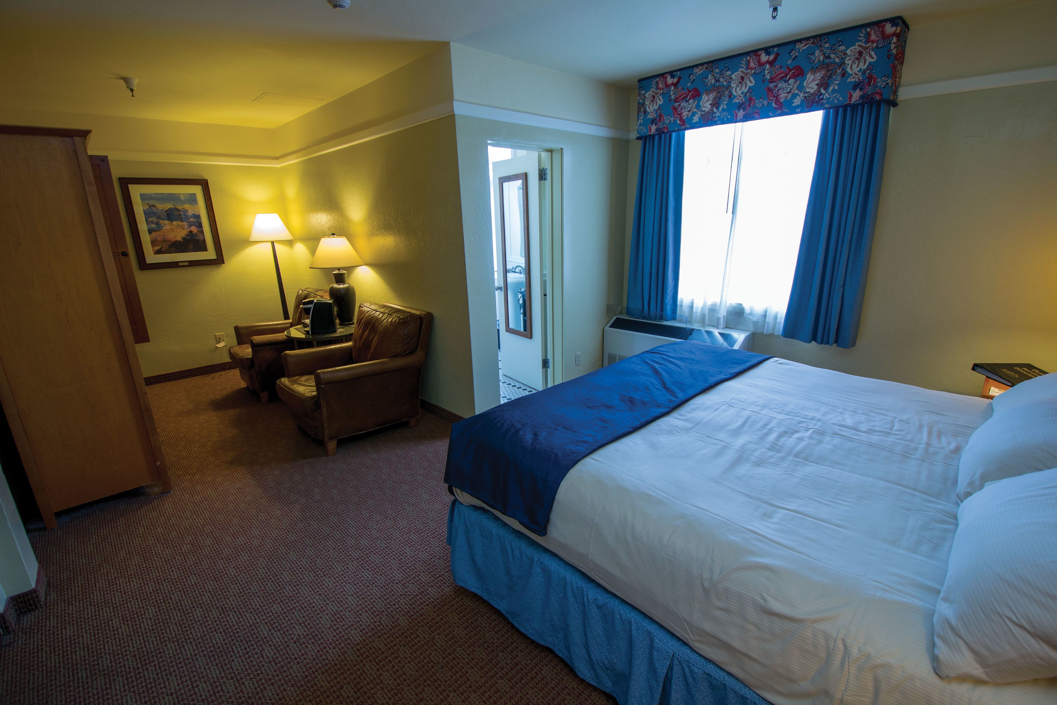deluxe room, 1 king bed | in-room safe, desk, iron/ironing board, rollaway beds