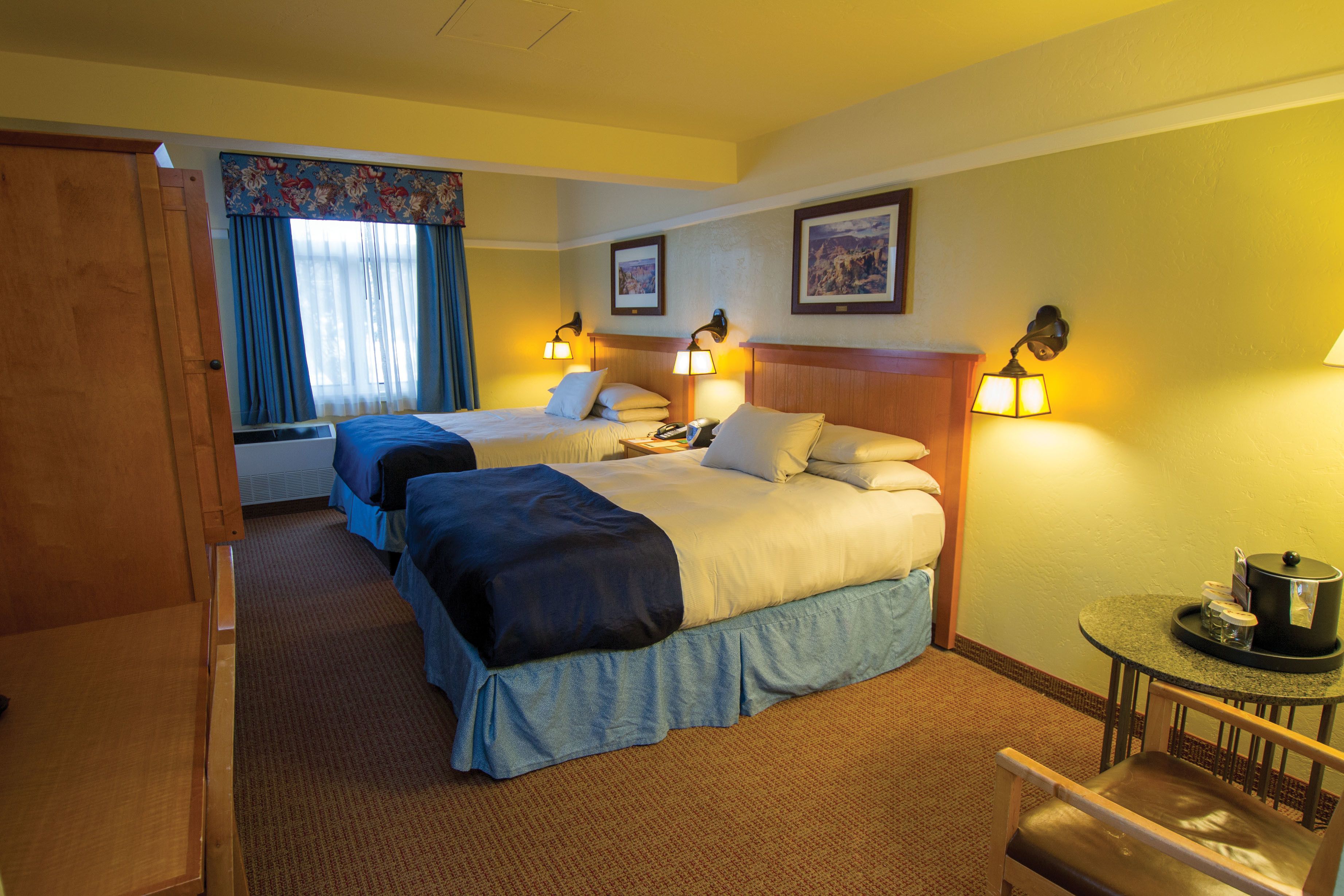 standard room, 2 queen beds | in-room safe, desk, iron/ironing board, rollaway beds