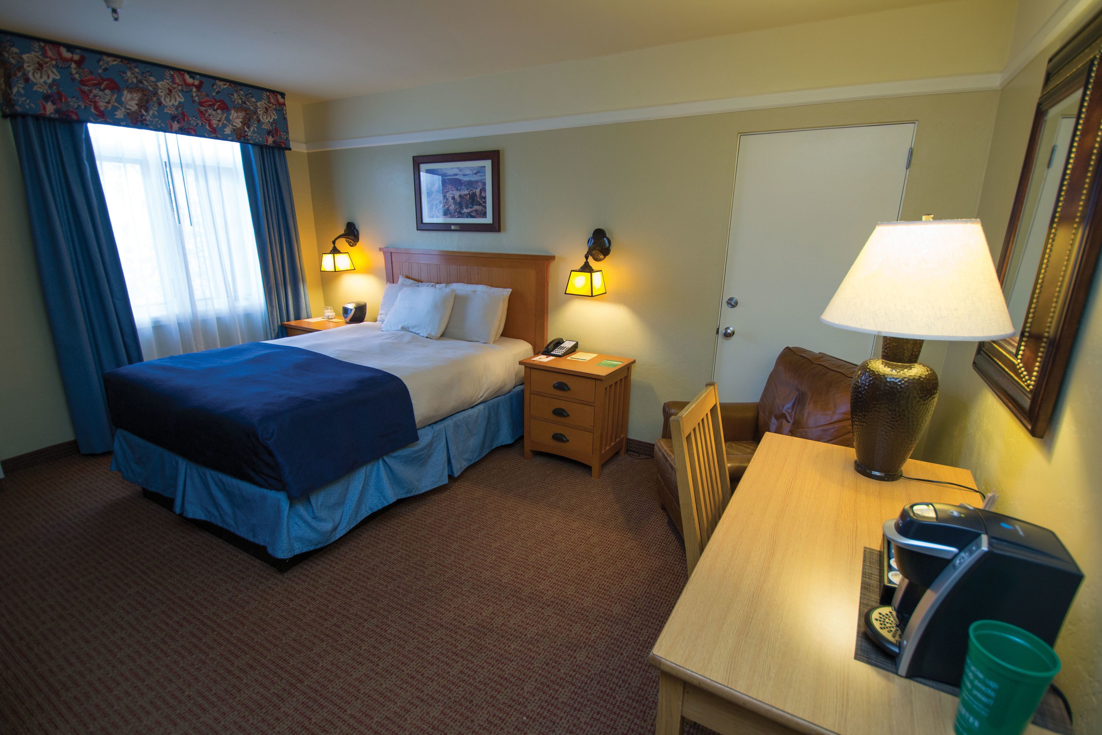standard room, 1 queen bed street level | in-room safe, desk, iron/ironing board, rollaway beds