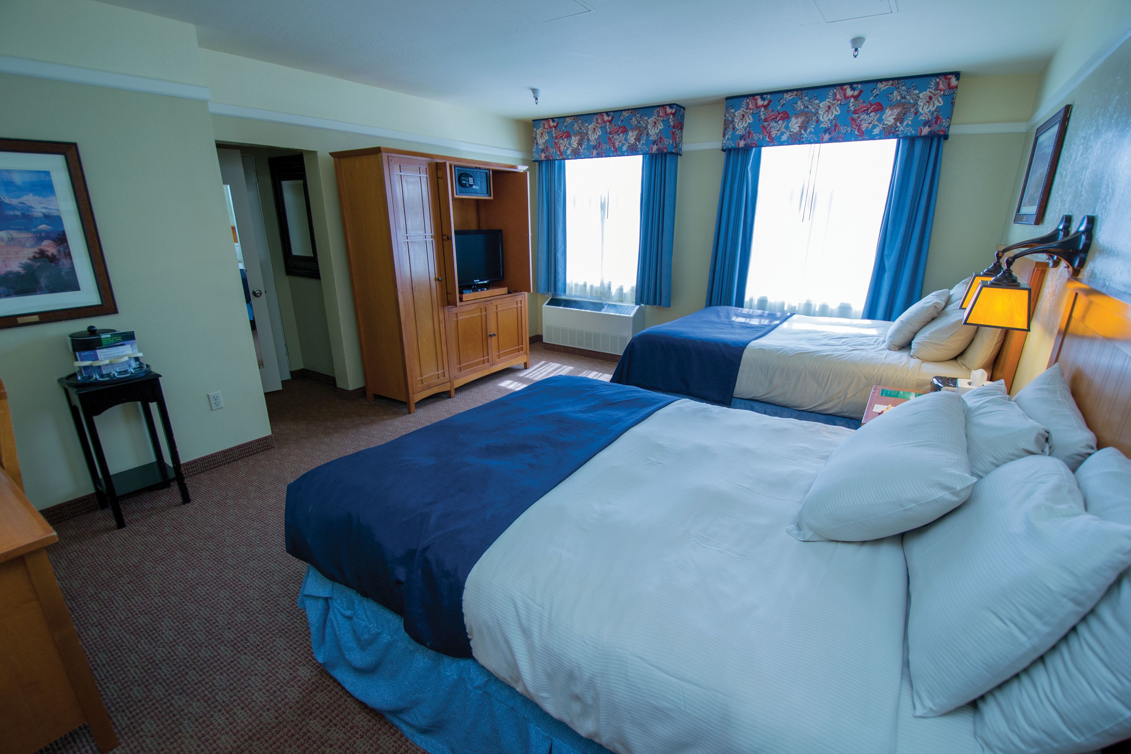 deluxe room, 2 queen beds | in-room safe, desk, iron/ironing board, rollaway beds