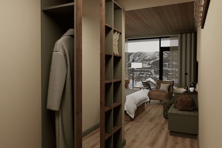 A bedroom with a large window, a bed, a chair, a nightstand, and a wardrobe.. Dr. Holms Hotel