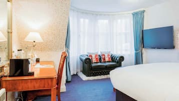 Suite, uitzicht op zee | Woonruimte | Lcd-televisie