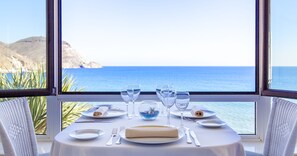 Breakfast, lunch, dinner served; Mediterranean cuisine, beach views 