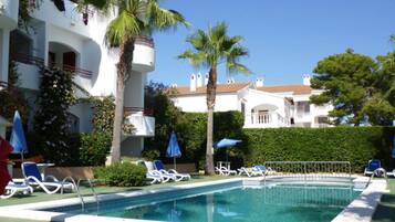 Outdoor pool, pool umbrellas, pool loungers