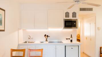 Fridge, stovetop, espresso maker, coffee/tea maker