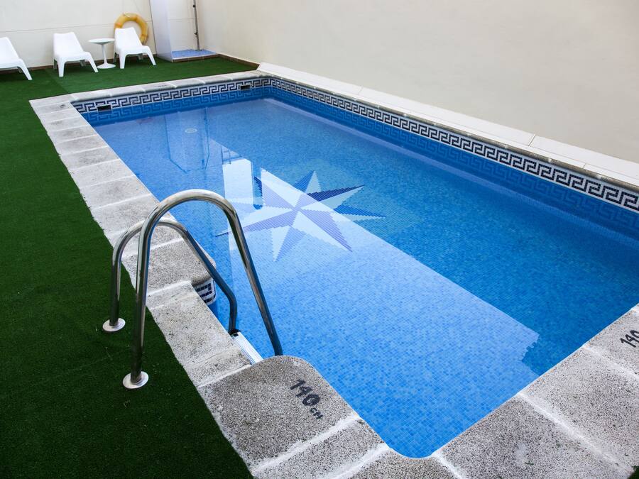 Seasonal outdoor pool, pool loungers