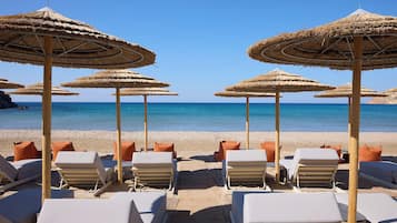 Private beach, white sand, sun loungers, beach umbrellas