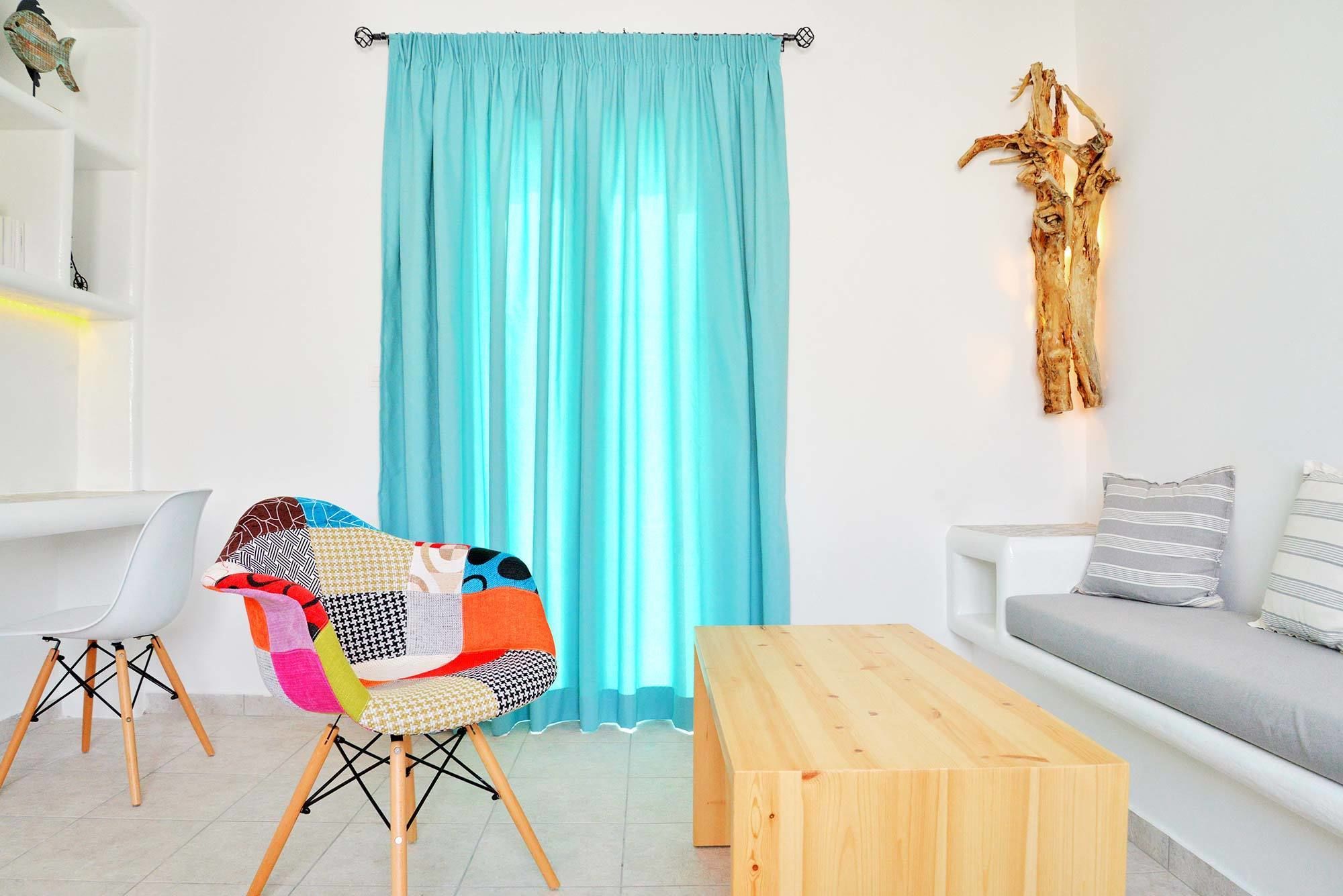 superior room, partial sea view | living area | flat-screen tv