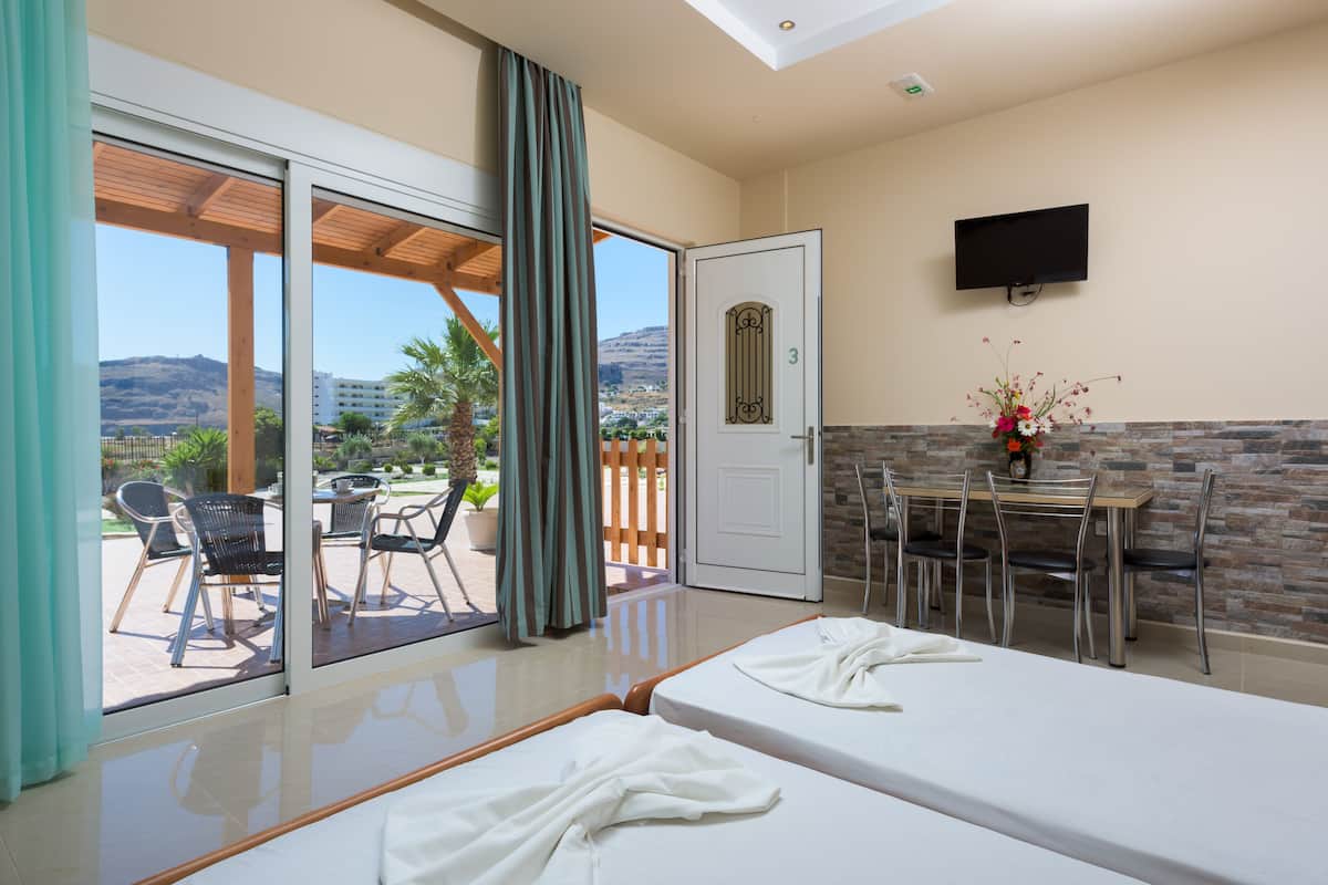 Deluxe Double room with Sea view (Apartment 13) | Living area | 32-inch flat-screen TV with satellite channels, TV