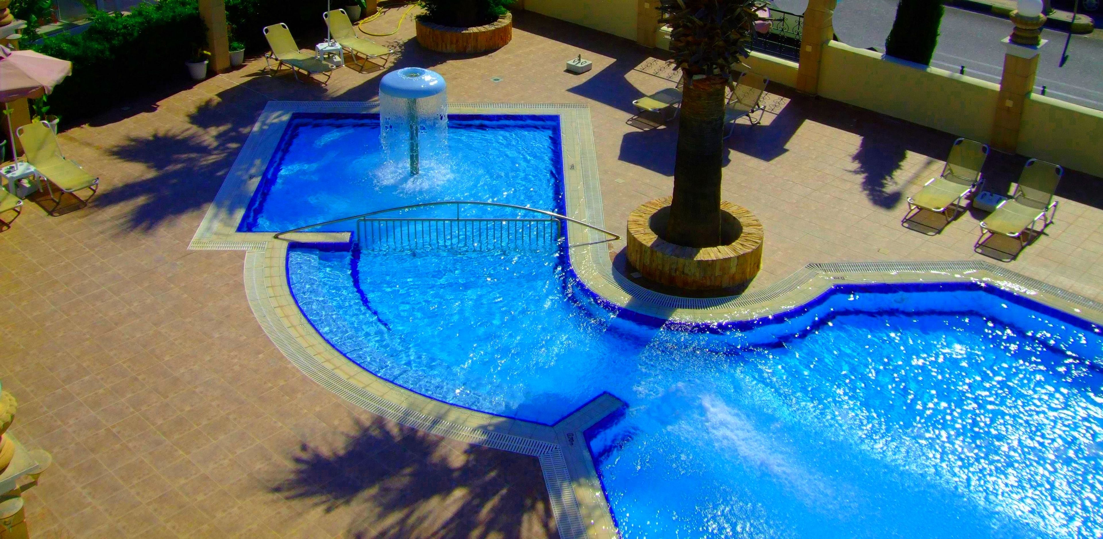 outdoor pool, pool umbrellas, pool loungers