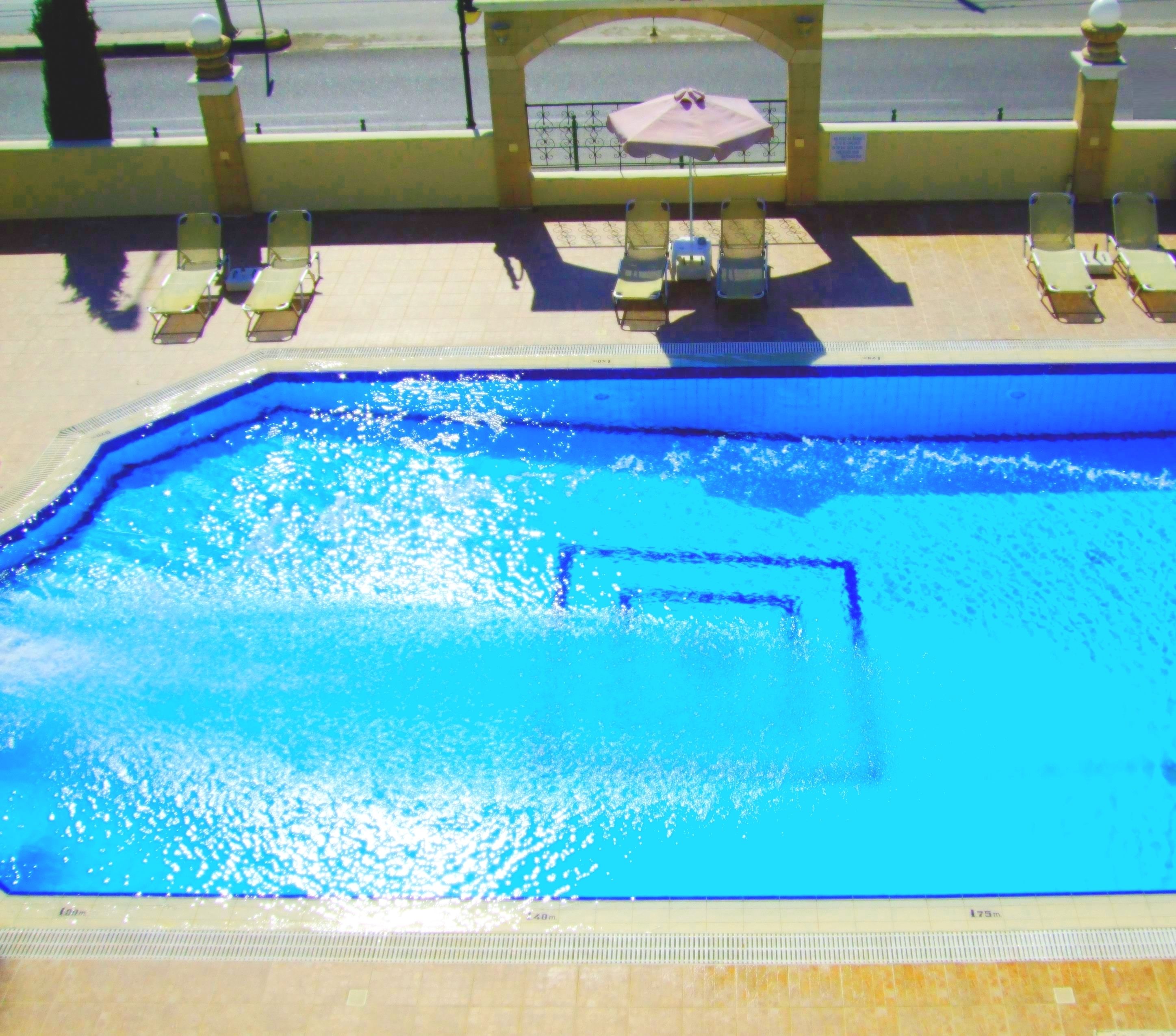 outdoor pool, pool umbrellas, pool loungers