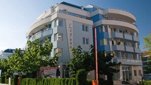 A multi-story building with balconies and a sign reading "Laguna". - Laguna Holiday (Sunny Beach)
