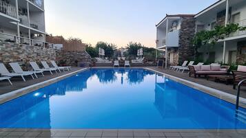 Outdoor pool, pool umbrellas, pool loungers