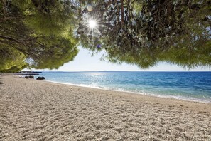 On the beach, beach cabanas, sun-loungers, beach umbrellas