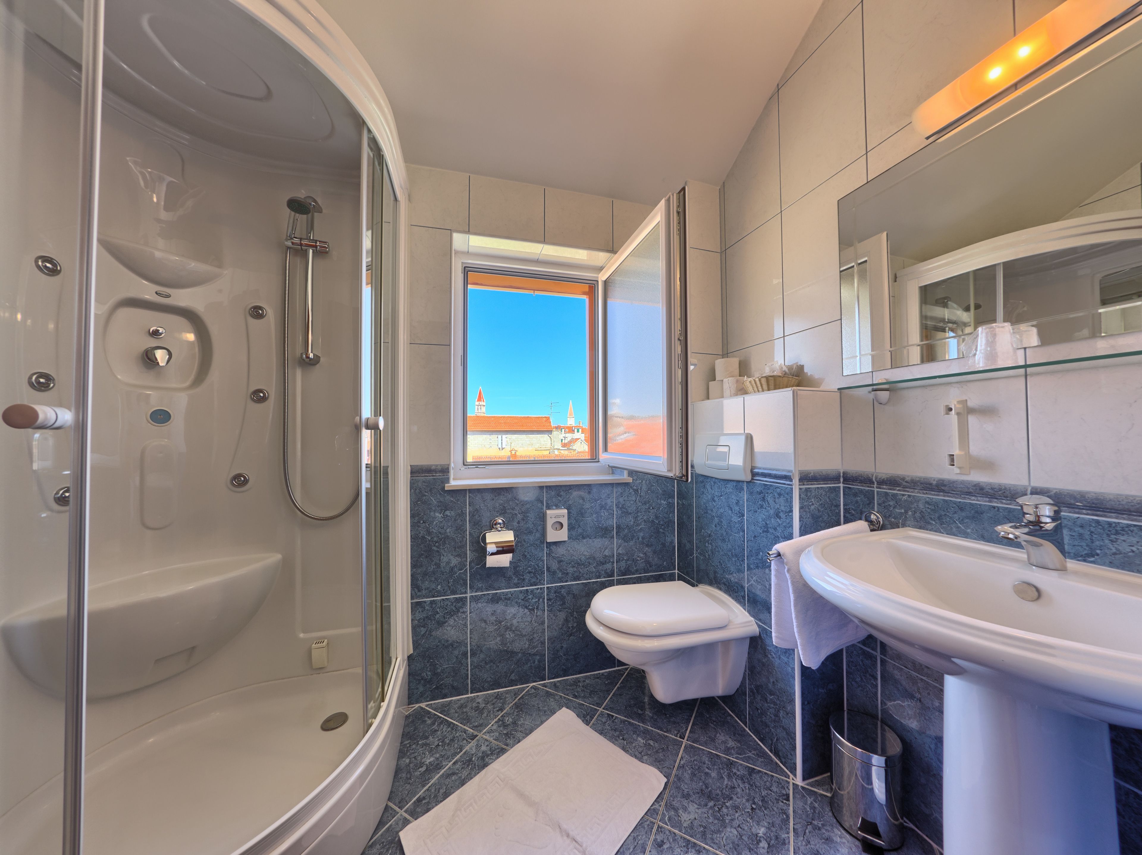 family room, sea view | bathroom | shower, free toiletries, hair dryer, bathrobes