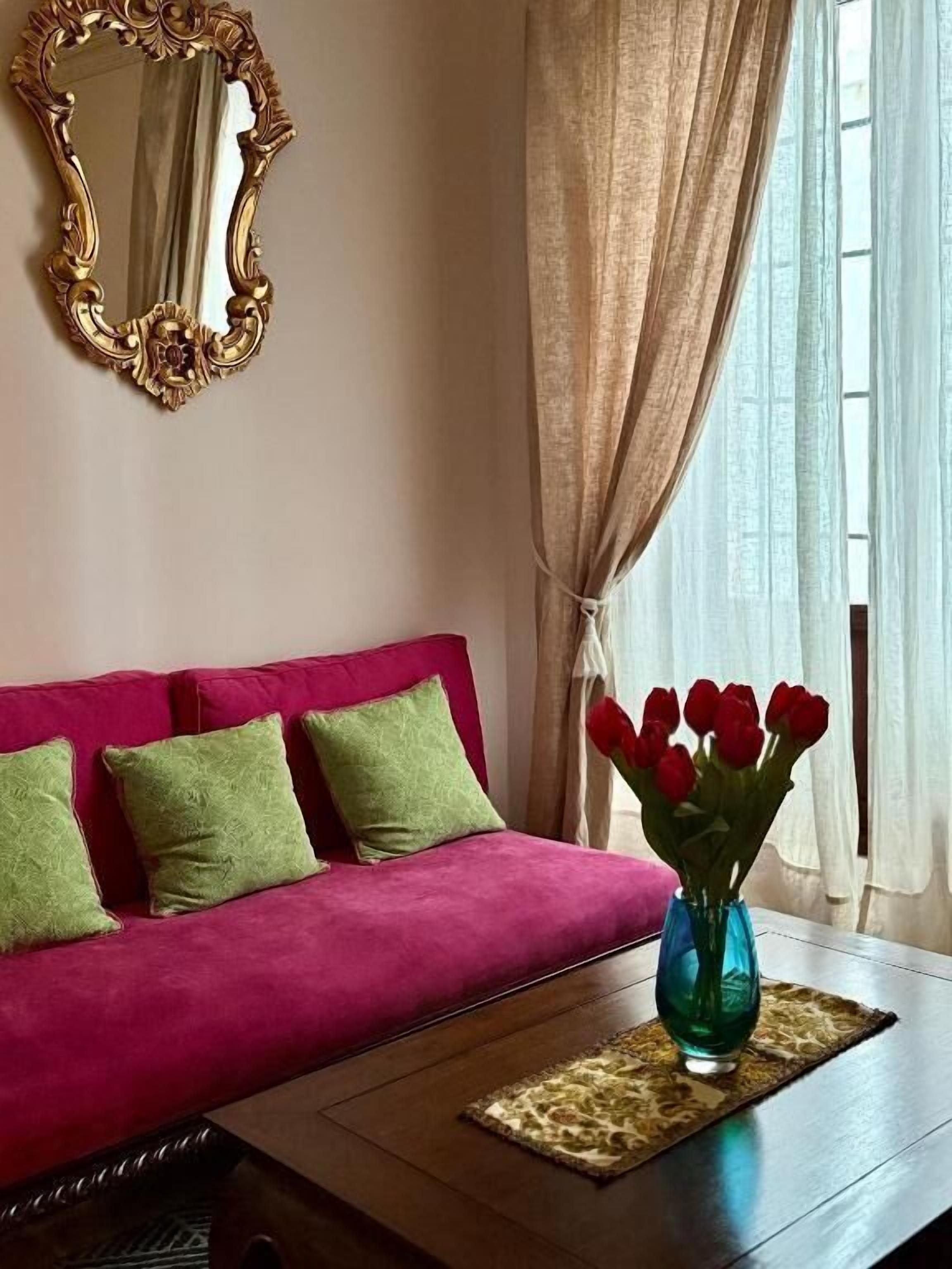 deluxe suite, balcony, city view | living area | lcd tv