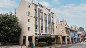 A multi-story hotel with a flat facade, large windows, and a sign for 'Fragrance Hotel.' - Fragrance Hotel - Balestier (Singapore)